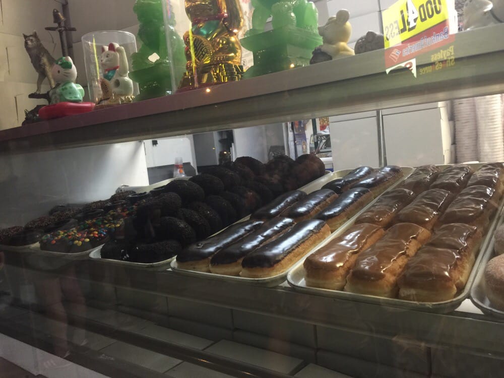 Chocolate bars and maple bars lined up in the case